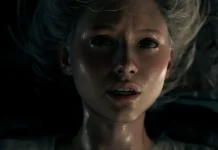 Resident Evil Requiem: pré-venda está dentro do padrão? Grace Ashcroft, protagonista de Resident Evil Requiem, aparece armada em um ambiente sombrio, simbolizando a nova geração da franquia de survival horror da Capcom. Saiba se vale sua pré-venda
