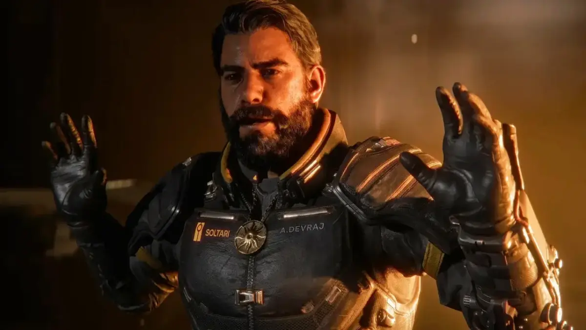 Confira os lançamentos de jogos da última semana de abril e início de maio de 2026 1 Personagem principal de Saros em close com armadura escura e expressão tensa em cenário de iluminação dramática, na lançamentos de jogos da última semana de abril.