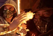 Ingresso para Mortal Kombat II dá 750 Dragon Krystals em MK1: Definitive Edition Dois personagens mascarados em cena do filme Mortal Kombat II, com chamas ao centro
