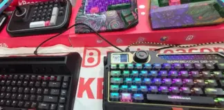 Teclado mecânico gamer DarkBeacon DB-K31 com design moderno e retro ao lado de modelo estilo Atari vintage na Eletrolar Show 2026