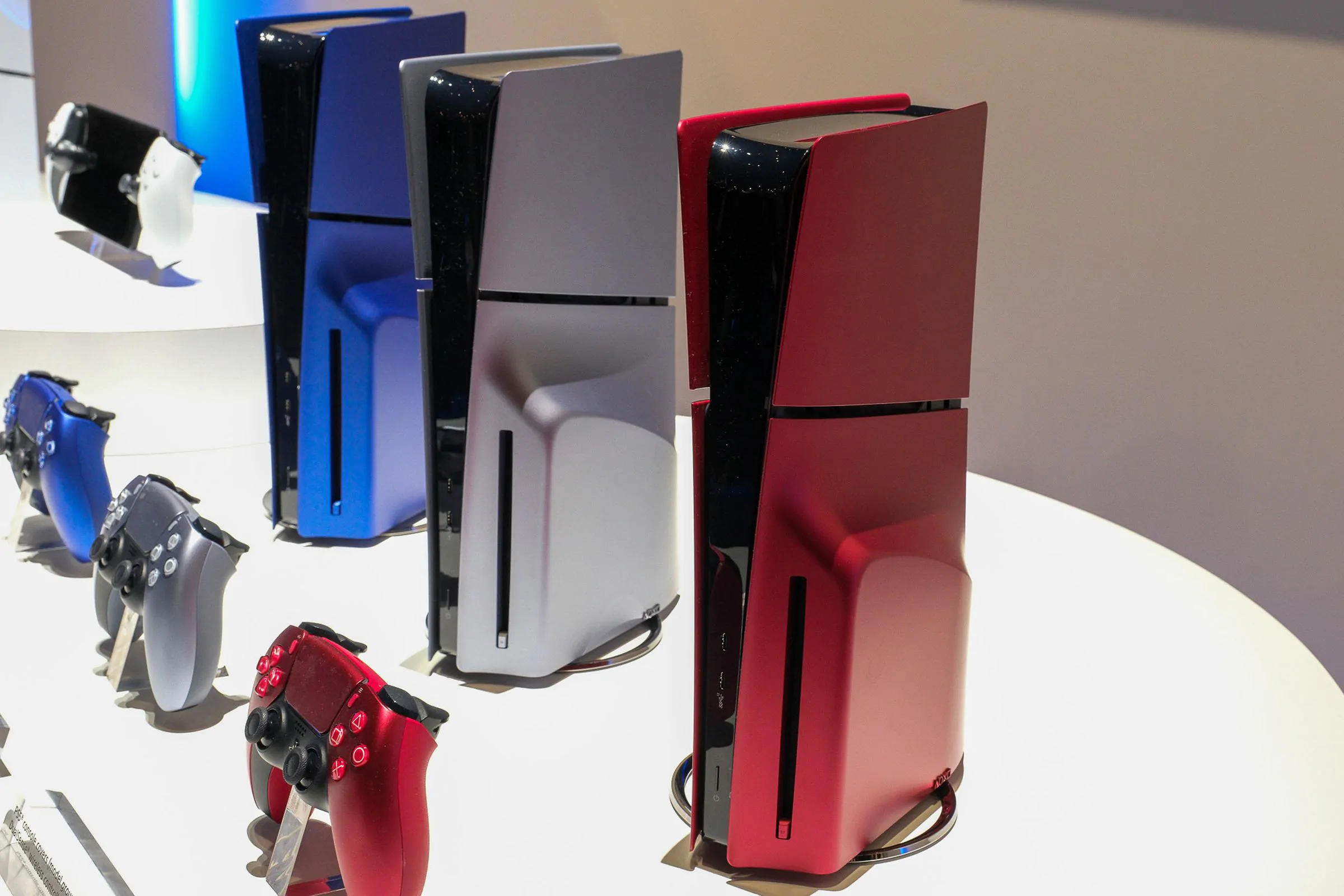 A photo of Sony’s PS5 slim in various colors at CES 2024.