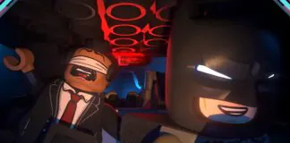 Batman Lego em cena cinemática com iluminação vermelha dramática em Lego Batman The Legacy of the Dark Knight
